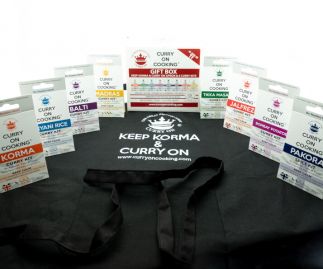 8 Curry Kits with a KEEP KORMA & CURRY ON Apron 