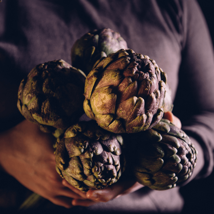 someone holding
    fruit